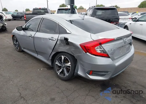 2017 Honda Civic Touring z USA, uszkodzony, nr VIN 2HGFC1F9XHH634745